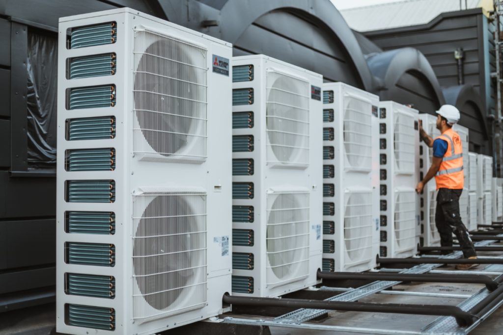 Air conditioning units being installed in a commercial building