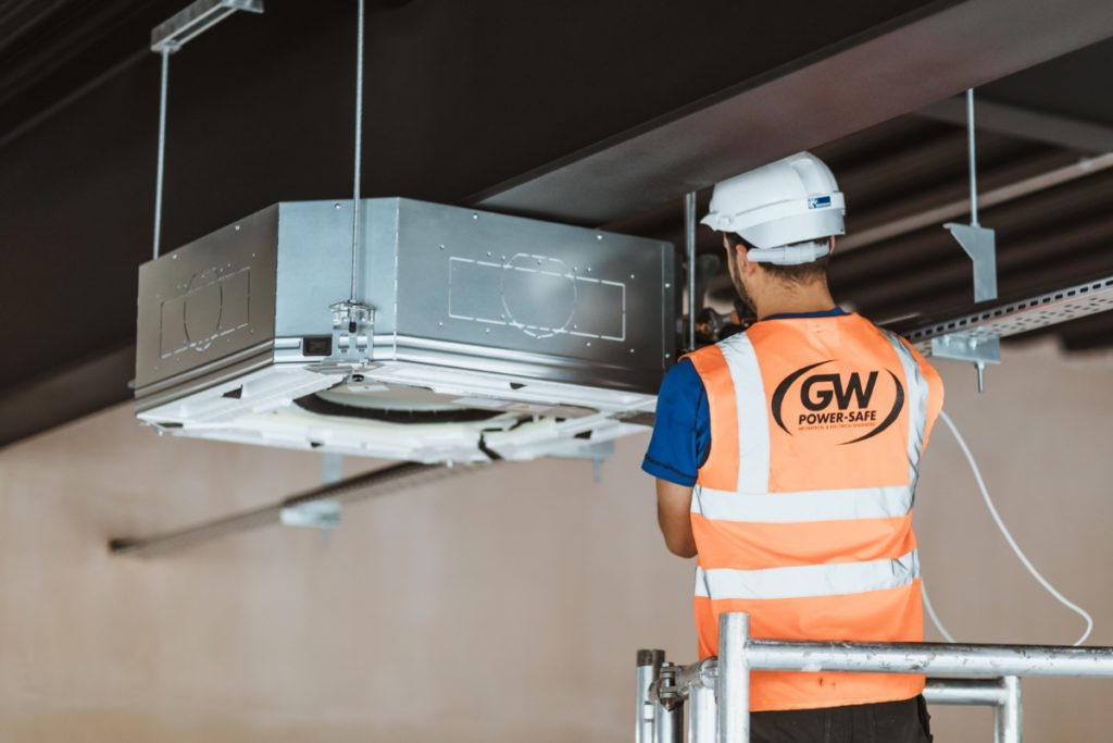 GW Power Commercial Engineer fitting an air conditioner in Hull